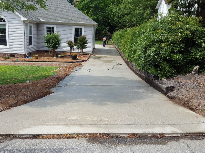 Putting the finishing touches on a huge driveway cleaning job.