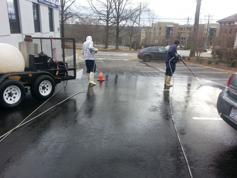 Commercial concrete cleaning on a parking lot.