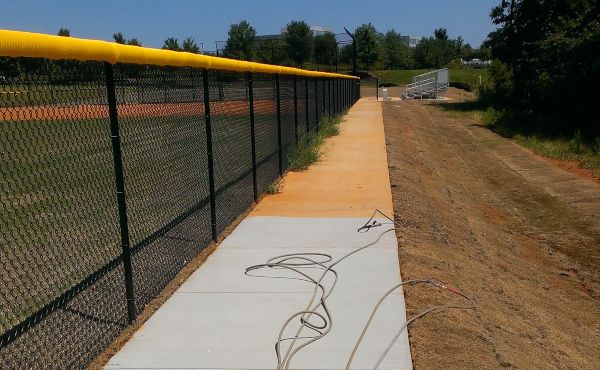 Stunning results on a baseball field pressure washing concrete.