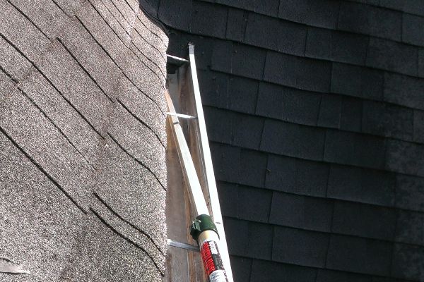 Getting every last speck out of the gutters before Raindrop gutter guards are installed.