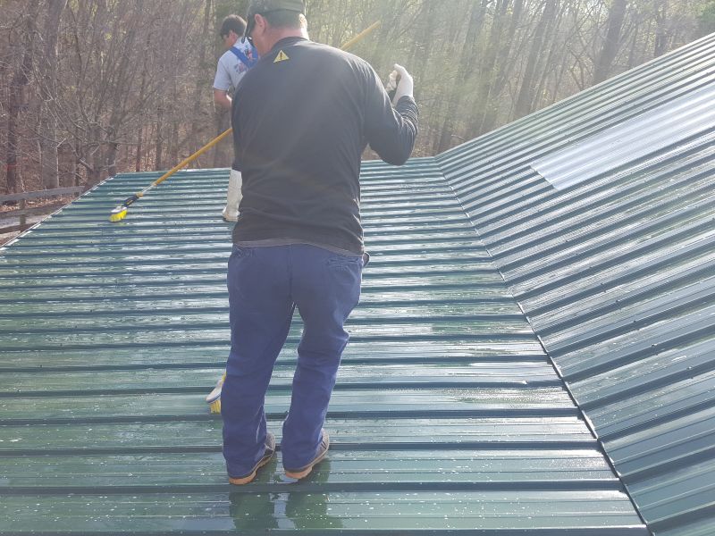 Scrubbing a dirty roof.