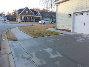 Freshly cleaned concrete driveway with Precision.